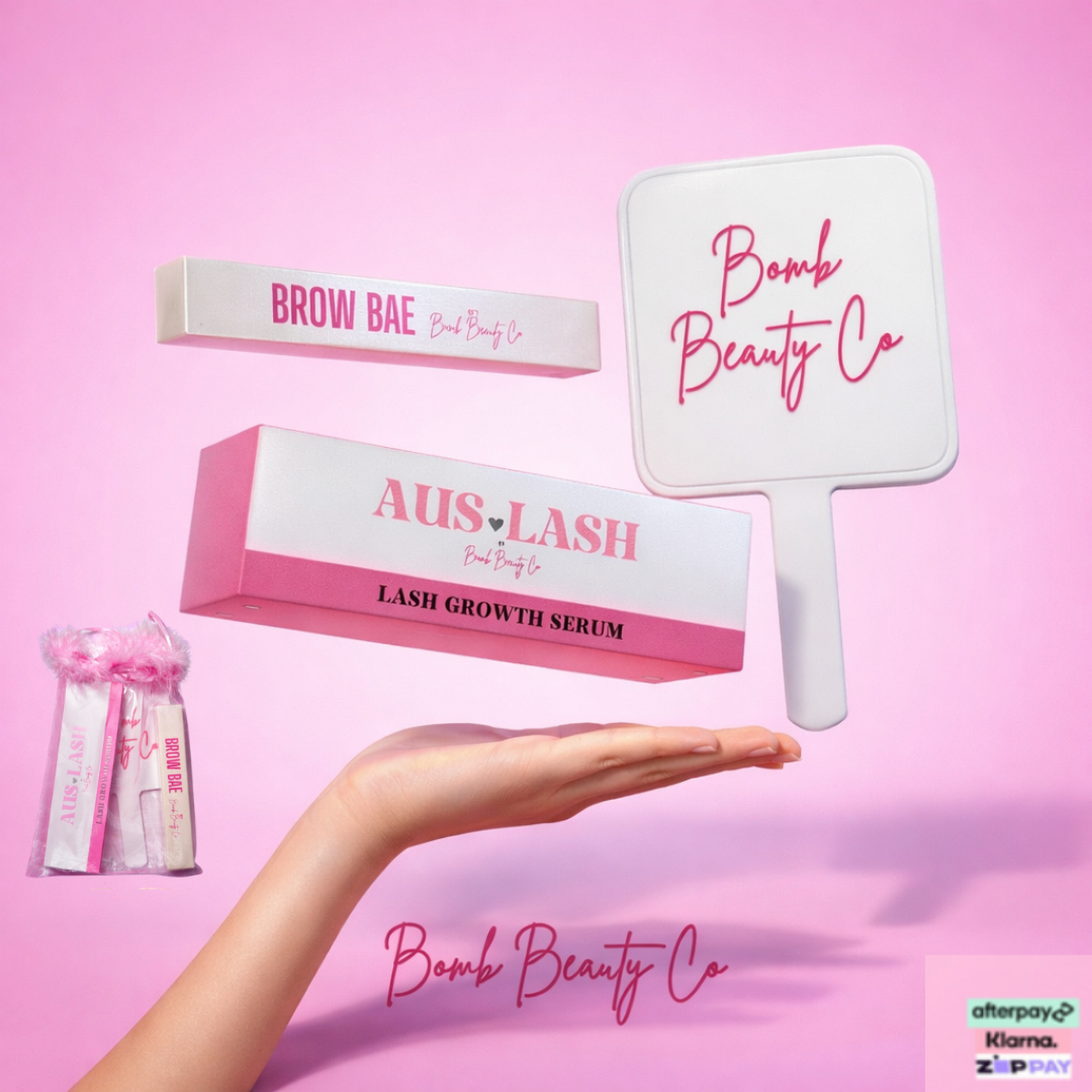 Beauty products from Bomb Beauty Co on a pink background