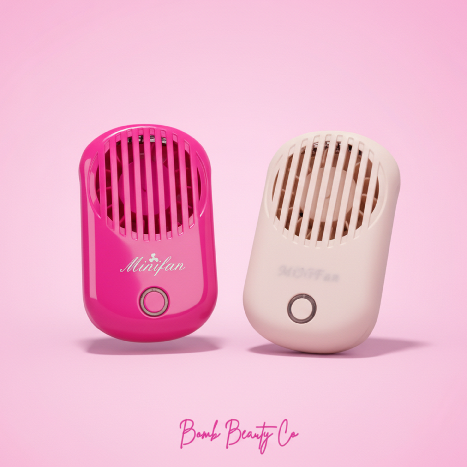 Two hand held lash fans, one pink and one white, with a detachable lanyard and USB rechargeable feature.