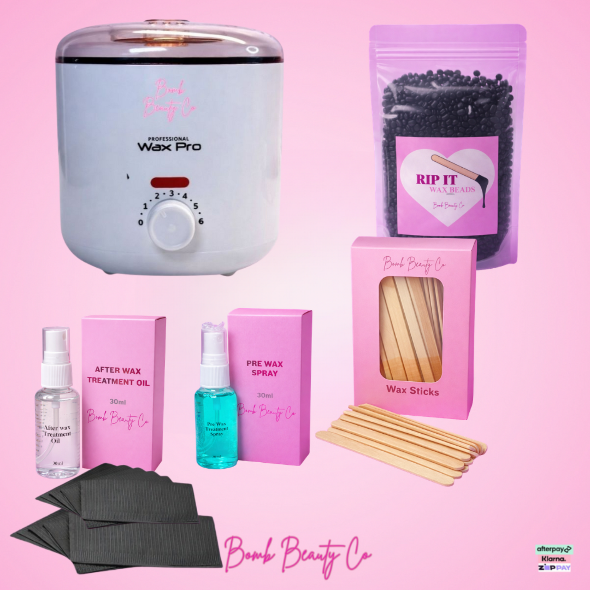 Waxing kit with wax machine, wax sticks, and related products on a pink background